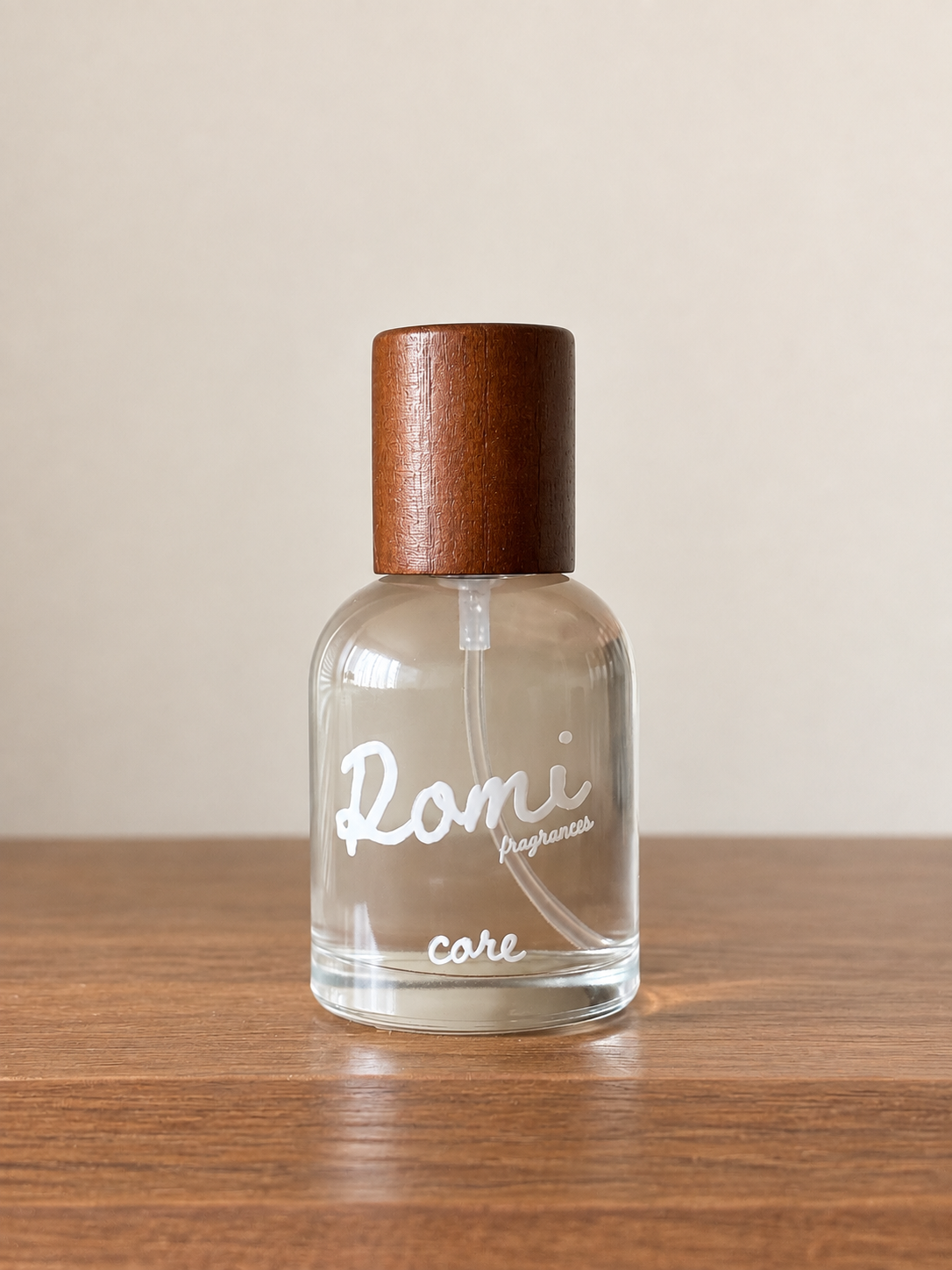 a clear bottle with a brown cap
