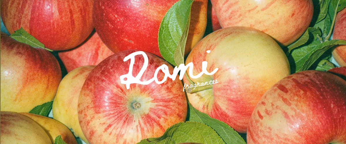a group of apples with leaves